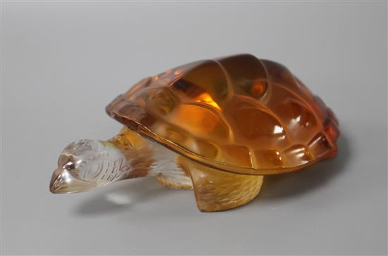 A modern Lalique amber tinted glass model of a turtle, signed with Made in France sticker, length 14.5cm